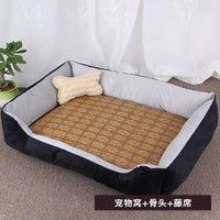 Black and gray pet bed with bone pillow.