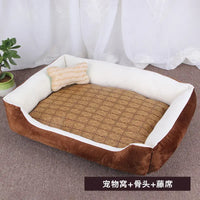 Brown and white pet bed with bone-shaped pillow.