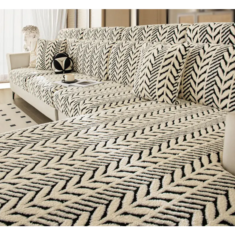 Black and white patterned sectional sofa.
