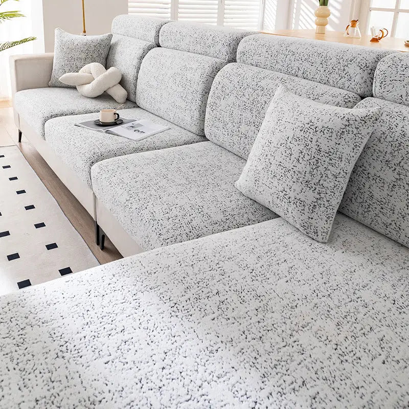 Textured white sectional sofa.