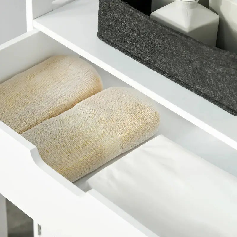 Open drawer with folded towels.