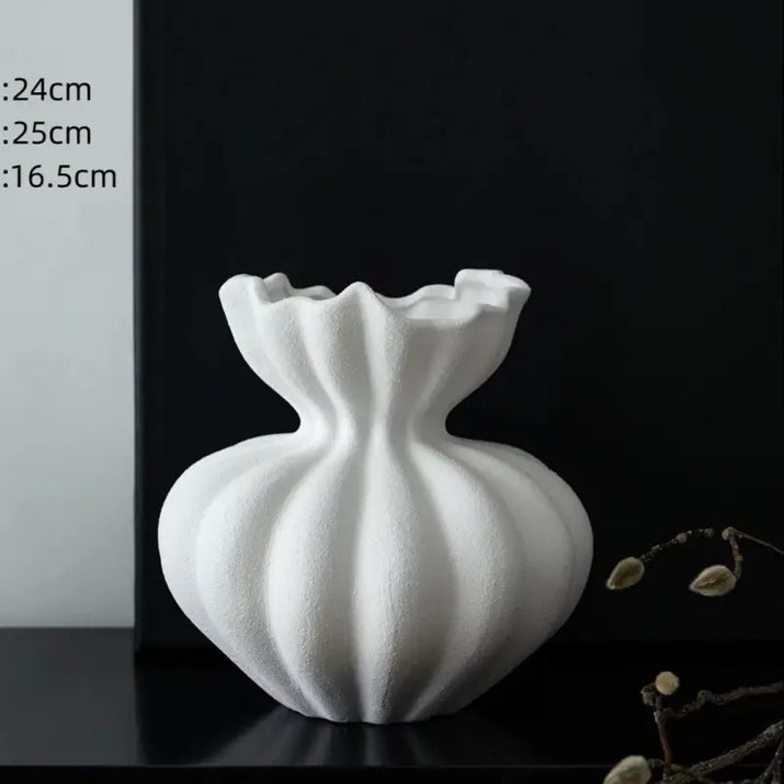 White, textured, gourd-shaped vase.