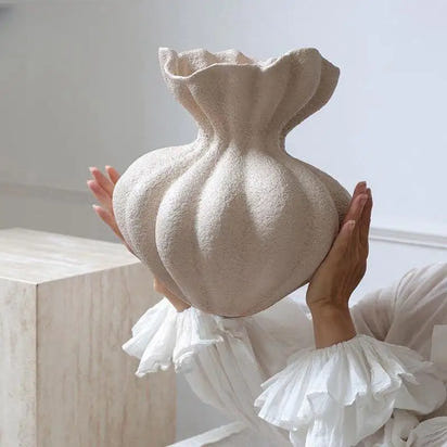 Textured beige ceramic vase.