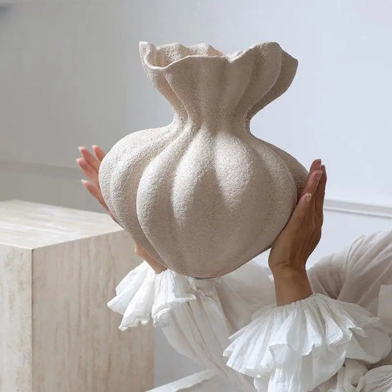 Textured beige ceramic vase.