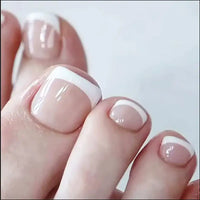 Toes with French pedicure.