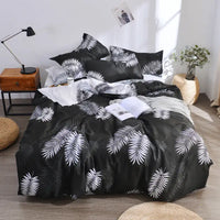 Black and white leaf-patterned bedding.