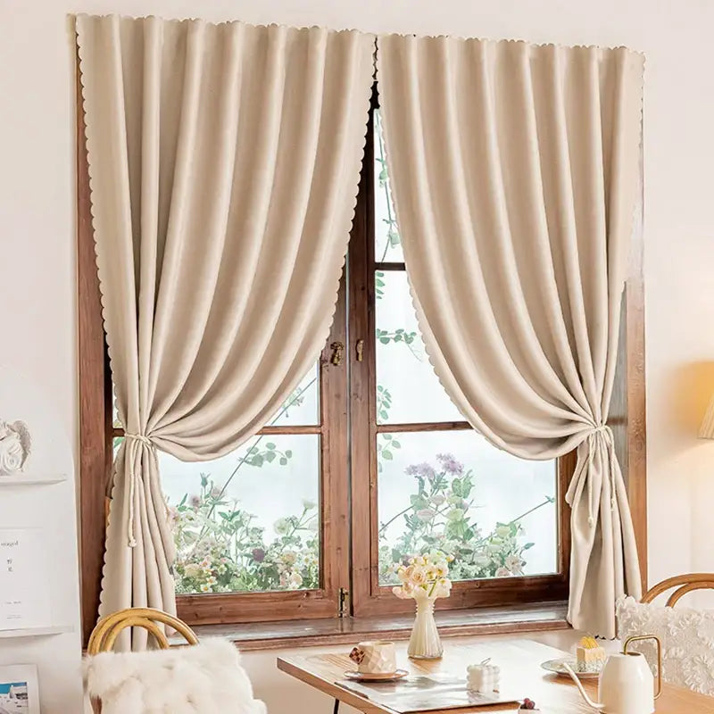 Beige scalloped curtains.