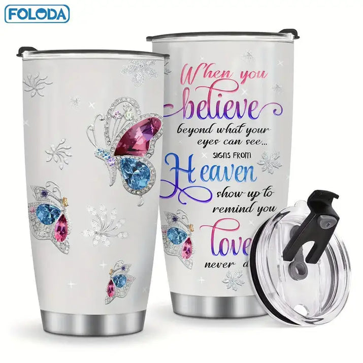 Two white tumblers with butterfly and floral designs.