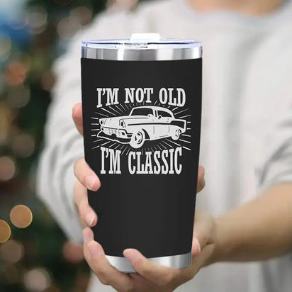 Black tumbler with classic car design.