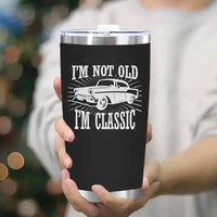 Black tumbler with classic car design.