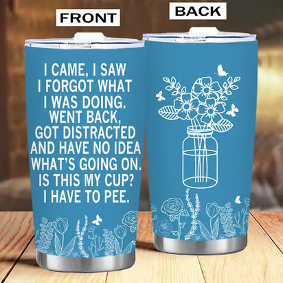 Blue tumbler with humorous text and floral designs.