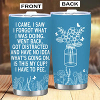 Blue tumbler with humorous text and floral designs.