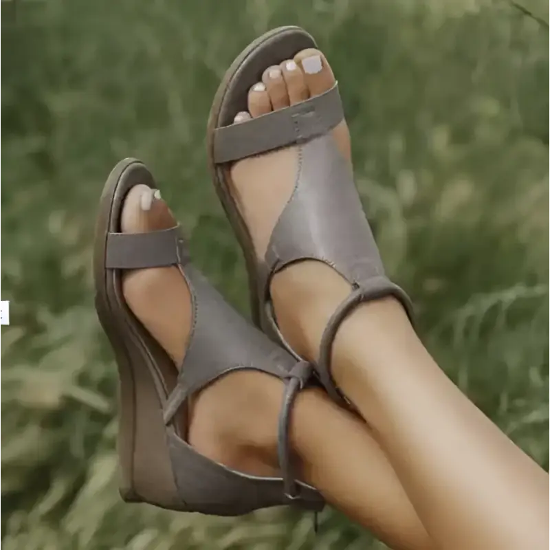 Gray leather wedge sandals.