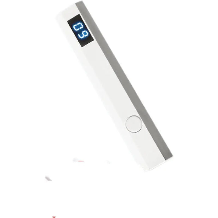 White rectangular power bank with digital display.