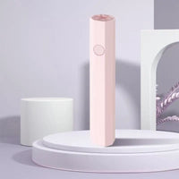 Pink hexagonal beauty device.