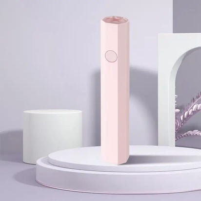 Pink hexagonal beauty device.