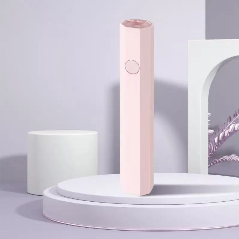Pink hexagonal beauty device.