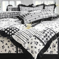 Black and white patterned bedding.