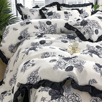 Floral-patterned bedding with ruffled trim.