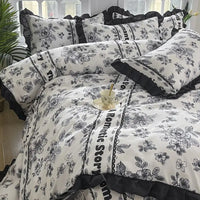 Floral patterned bedding set with ruffled trim.