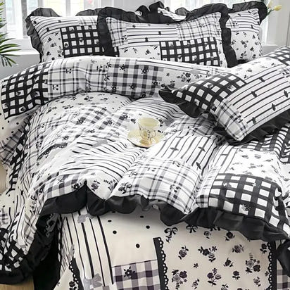 Black and white patchwork bedding.