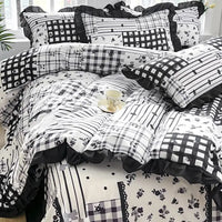 Black and white patchwork bedding.