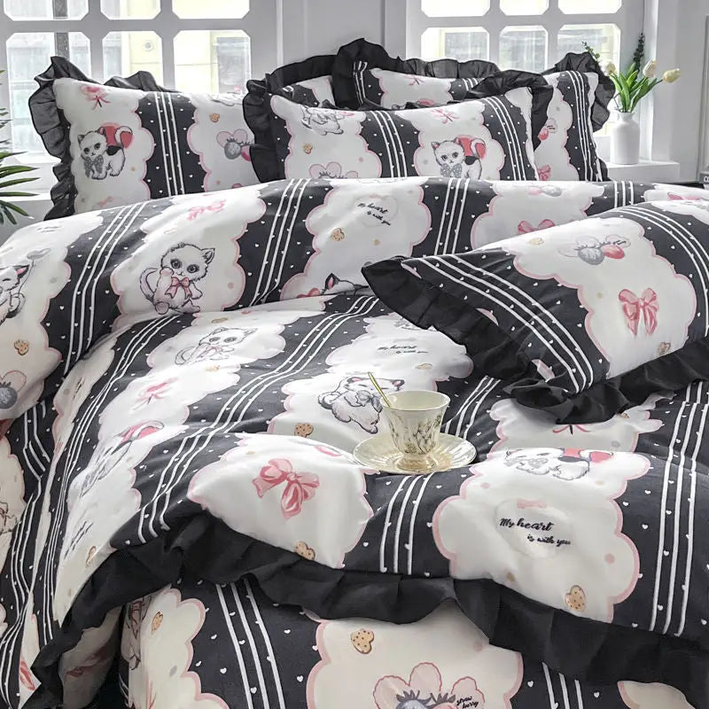Black and white cat-themed bedding.
