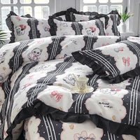 Black and white cat-themed bedding.
