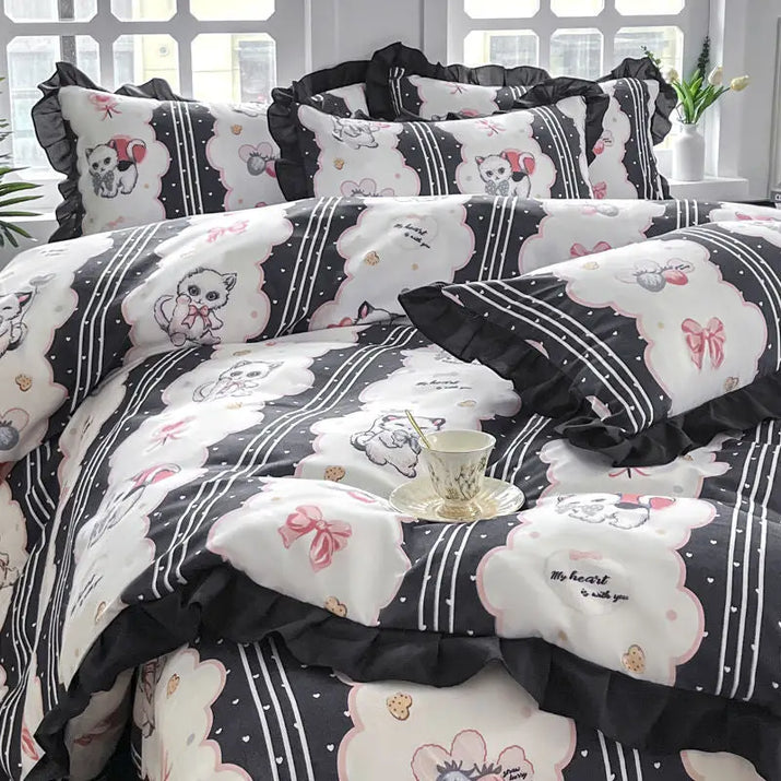 Black and white cat-themed bedding.