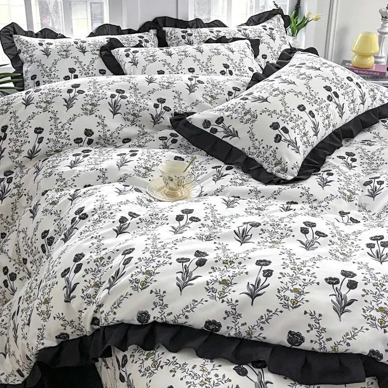 Floral patterned bedding with ruffled trim.