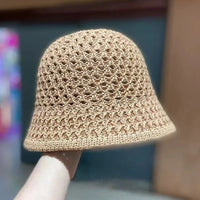 Beige crocheted bucket hat.