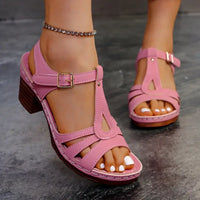 Pink leather T-strap sandals.