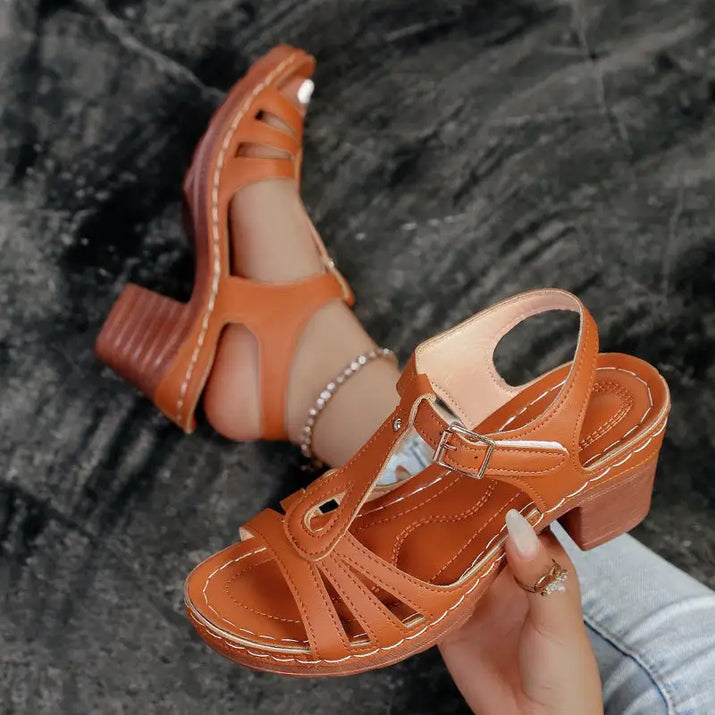 Brown leather heeled sandals.