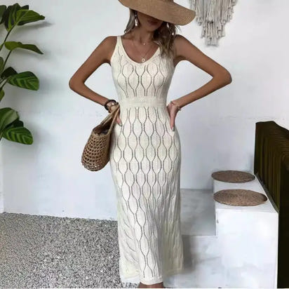 Knit midi dress with a straw hat and bag.