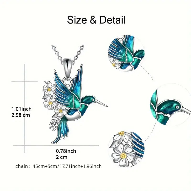 Hummingbird pendant necklace with flower accents.