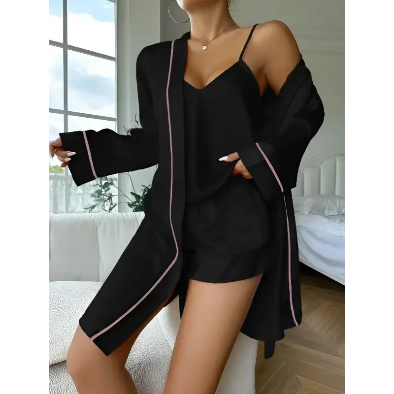 Black pajama set with pink trim.