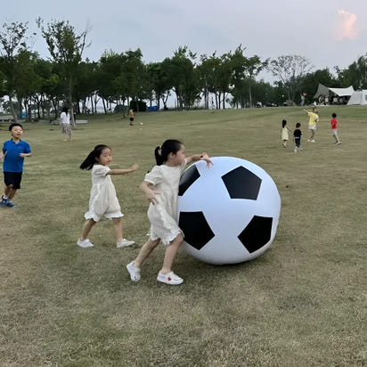 Oversized black and white soccer ball.