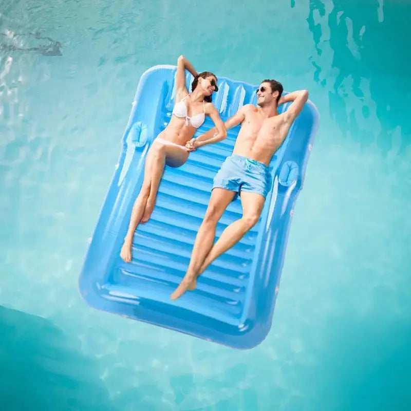 Inflatable pool raft with couple.