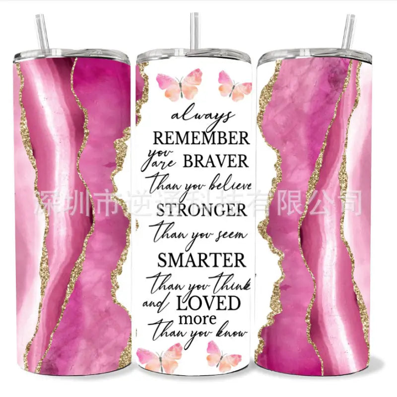 Three tumblers with inspirational messages and pink marble designs.