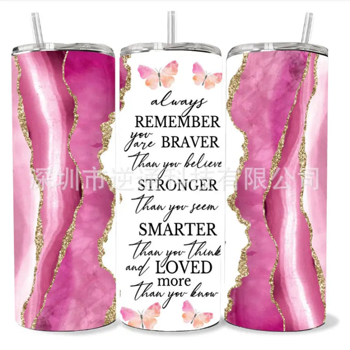 Three tumblers with inspirational messages and pink marble designs.