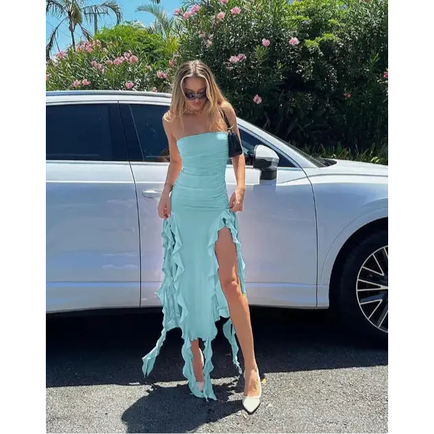 Light blue strapless dress with ruffled slits.