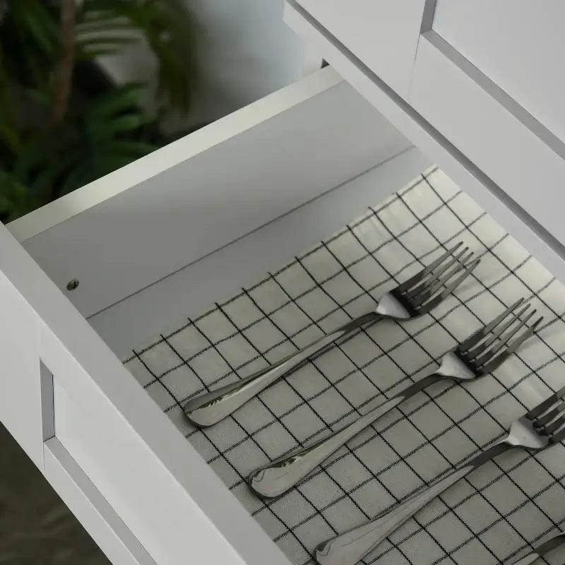 Silver forks in a drawer of the Grey Kitchen Pantry Cabinet for organized storage