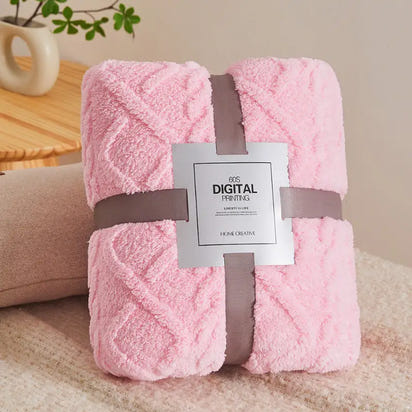 Pink plush blanket with gray ribbon.