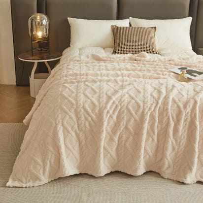 Textured, cream-colored blanket.
