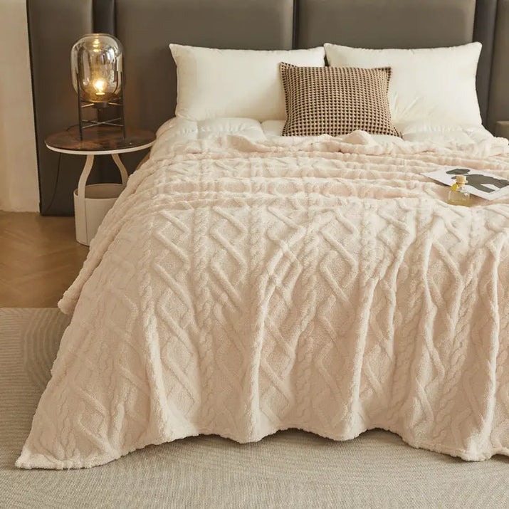 Textured, cream-colored blanket.