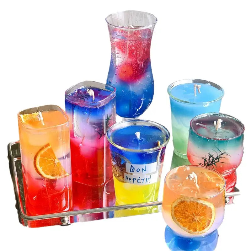 Colorful gel candles in glass containers.