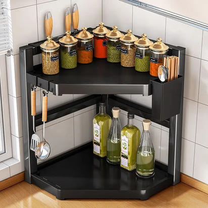 Two-tiered black corner shelf with spices and oils.