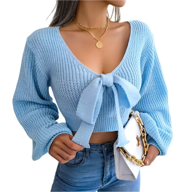 Light blue knit tie-front sweater.