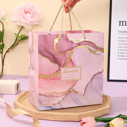 Pink marble-patterned gift bag.