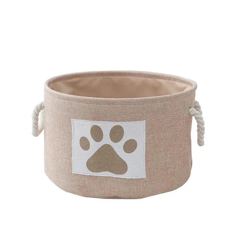 Beige fabric storage bin with paw print.